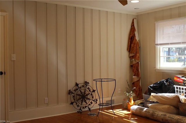 interior space with crown molding and wood finished floors