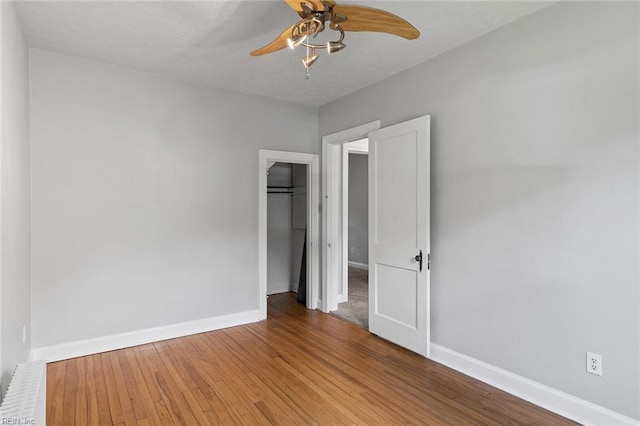 33 Mennonite Ln, Newport News, VA 23602 - unfurnished bedroom featuring baseboards, wood finished floors, a closet, and a ceiling fan