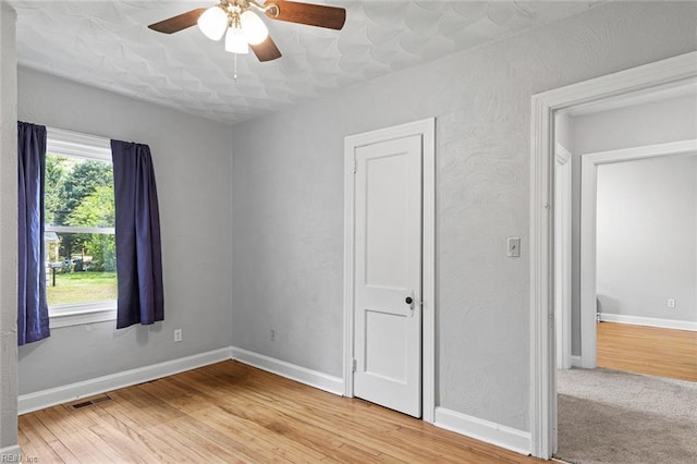 33 Mennonite Ln, Newport News, VA 23602 - empty room with baseboards, visible vents, light wood-style flooring, and a ceiling fan