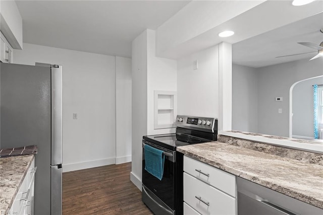 33 Mennonite Ln, Newport News, VA 23602 - kitchen featuring stainless steel appliances, dark wood-type flooring, white cabinets, a ceiling fan, and light stone countertops