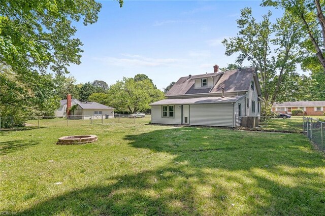 33 Mennonite Ln, Newport News, VA 23602 - view of yard featuring a fire pit and a fenced backyard
