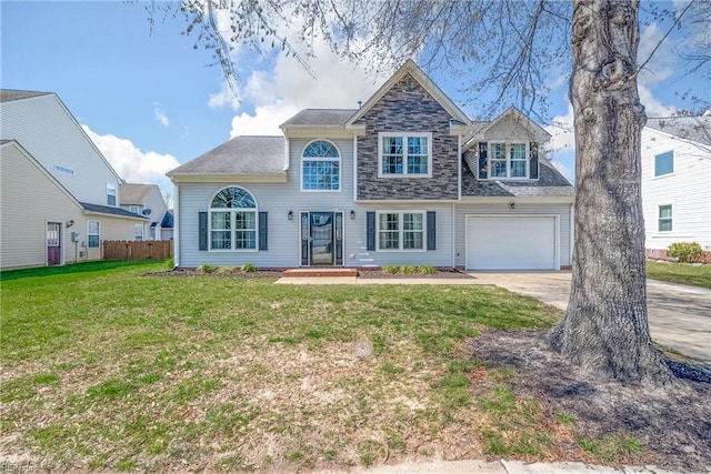 view of front of house with a garage, fence, a front lawn, and concrete driveway