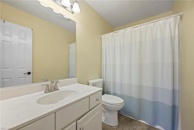 bathroom with toilet and vanity