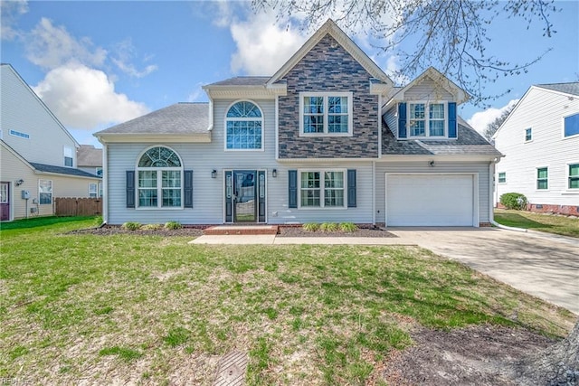 view of front of home with a shingled roof, fence, a front lawn, and concrete driveway