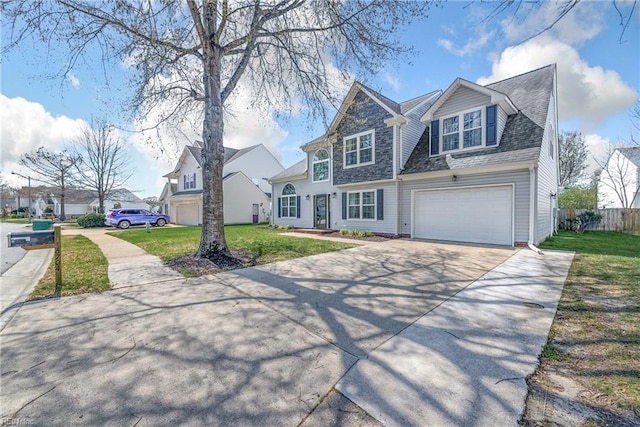 view of front of house with a front lawn, fence, a garage, and concrete driveway