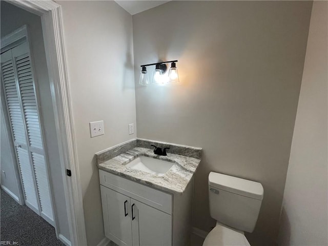 bathroom with toilet and vanity
