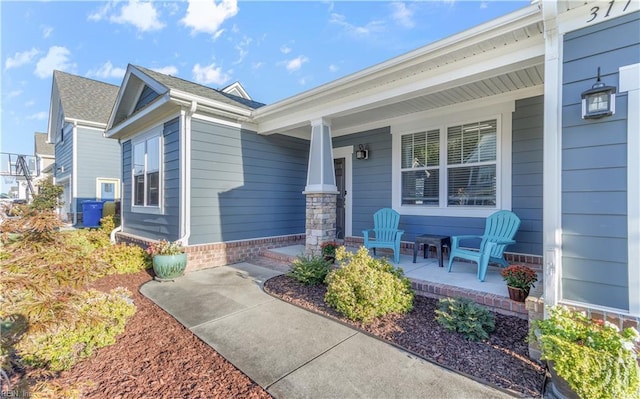 entrance to property featuring a porch