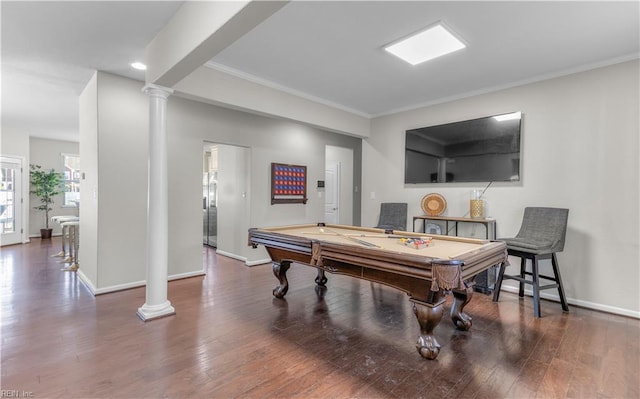 game room featuring baseboards, decorative columns, and wood finished floors