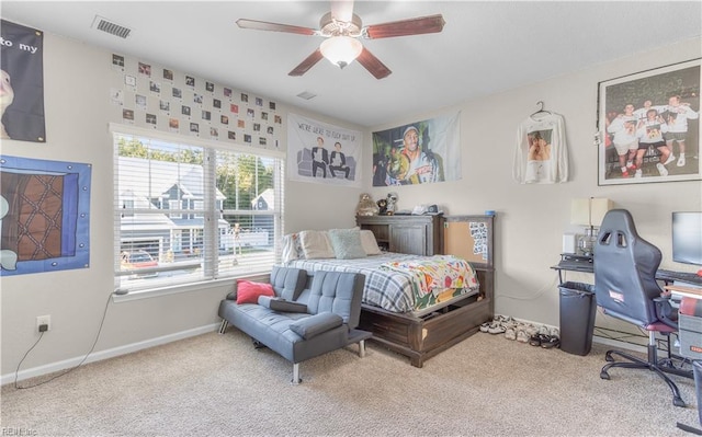 bedroom featuring baseboards, carpet flooring, ceiling fan, and visible vents
