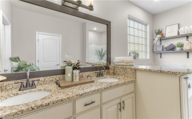 bathroom with double vanity and a sink