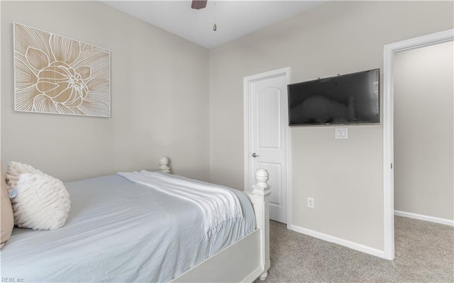 bedroom featuring baseboards, carpet floors, and a ceiling fan