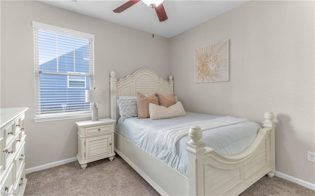 bedroom with light carpet, baseboards, and ceiling fan