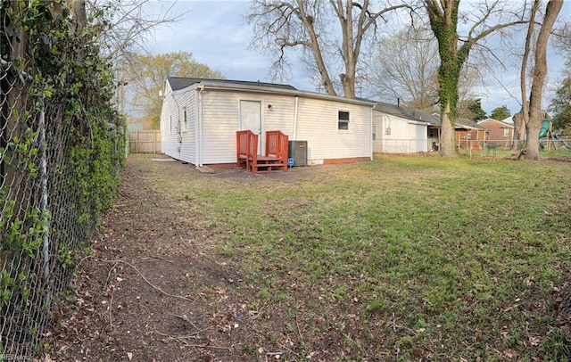 816 Westwood Ave, Hampton, VA 23661 - rear view of house featuring a lawn, a fenced backyard, and entry steps