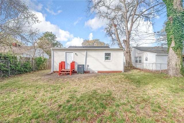 816 Westwood Ave, Hampton, VA 23661 - rear view of property featuring a fenced backyard, central AC, a yard, and entry steps