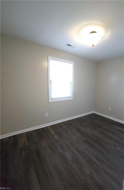 816 Westwood Ave, Hampton, VA 23661 - empty room featuring dark wood-type flooring, baseboards, and visible vents