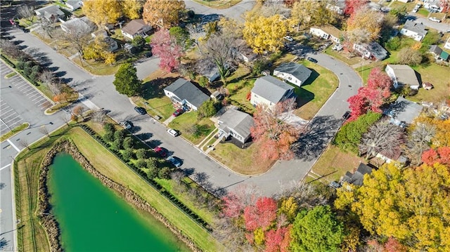 birds eye view of property featuring a residential view and a water view