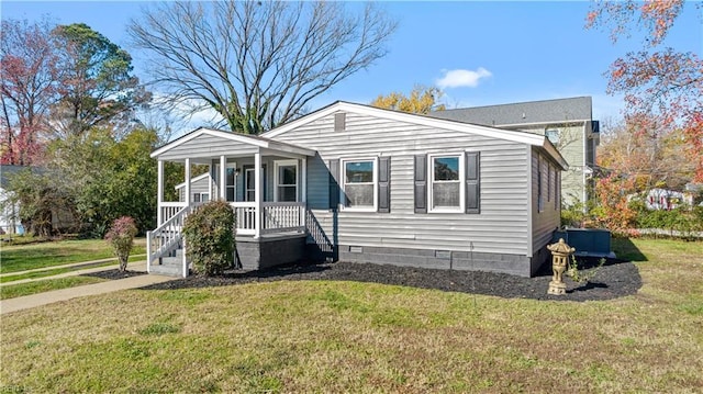 bungalow-style home with crawl space, a front lawn, and a porch