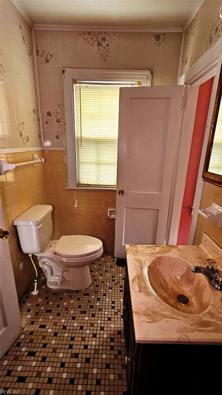 380 Hobson Ave, Hampton, VA 23661 - bathroom featuring toilet, vanity, and tile walls