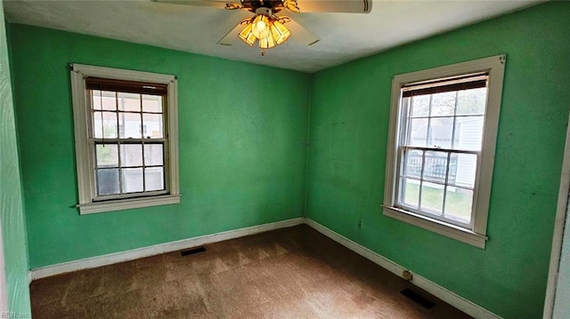 380 Hobson Ave, Hampton, VA 23661 - unfurnished room featuring baseboards, visible vents, dark carpet, and a ceiling fan