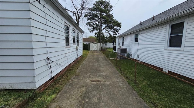 380 Hobson Ave, Hampton, VA 23661 - view of property exterior with an outdoor structure, fence, and a storage shed