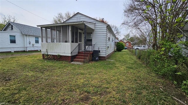380 Hobson Ave, Hampton, VA 23661 - exterior space featuring a sunroom, fence, and a yard