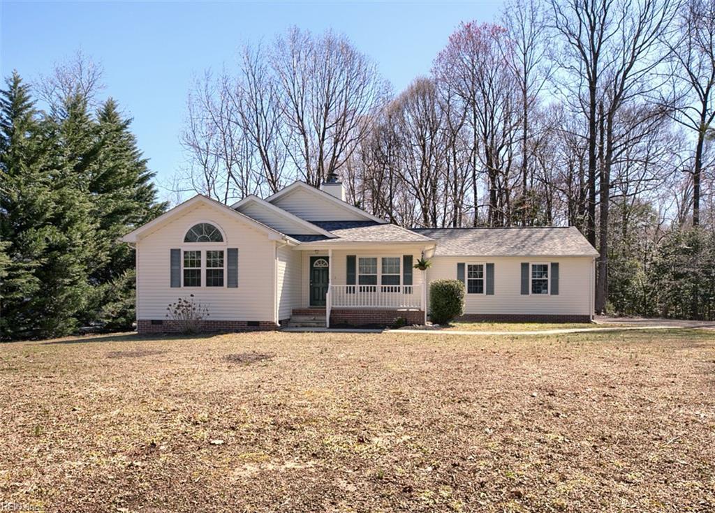 single story home with a porch, crawl space, and a front lawn