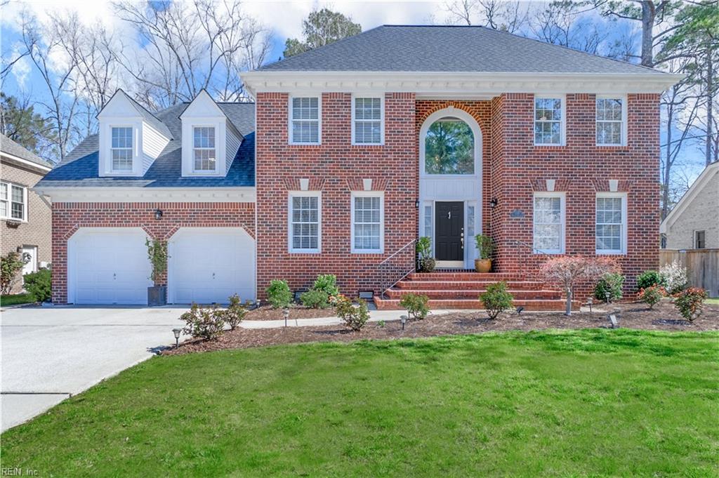 736 Tupelo Xing, Chesapeake, VA 23320 - view of front of home featuring a front yard, brick siding, concrete driveway, and an attached garage
