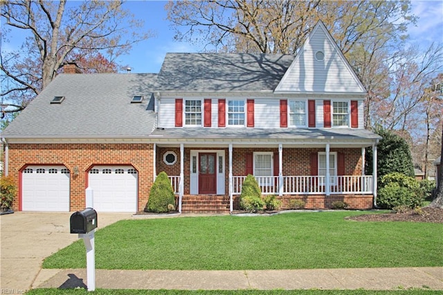 view of front of home with a chimney, a garage, a front lawn, driveway, and a porch