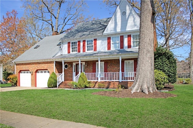 colonial house with driveway, a front yard, covered porch, a chimney, and an attached garage