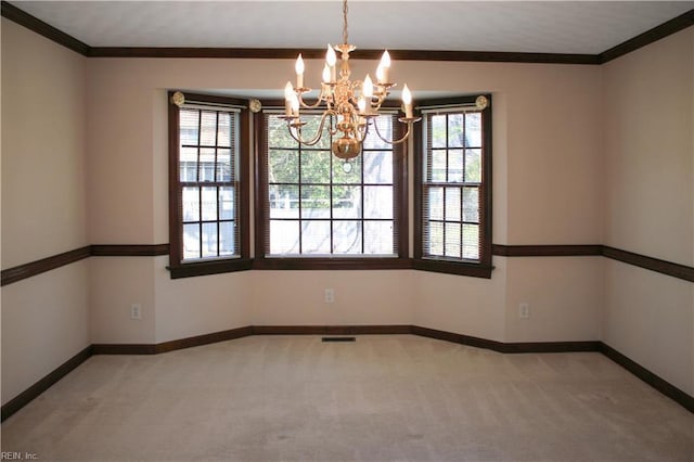 unfurnished room featuring baseboards, visible vents, a chandelier, and carpet