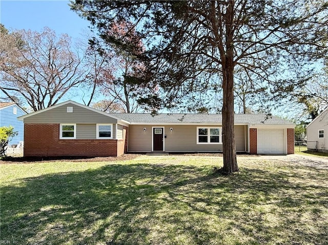 ranch-style home with a front lawn, a garage, and brick siding