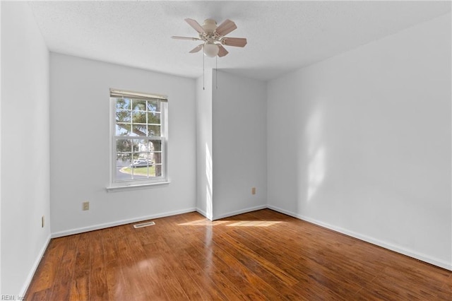 724 Oleander Cir, Virginia Beach, VA 23464 - spare room with a textured ceiling, baseboards, ceiling fan, and wood finished floors