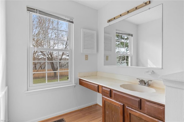 724 Oleander Cir, Virginia Beach, VA 23464 - bathroom featuring baseboards, wood finished floors, and vanity