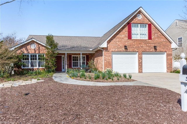 traditional-style house featuring driveway, a shingled roof, and brick siding