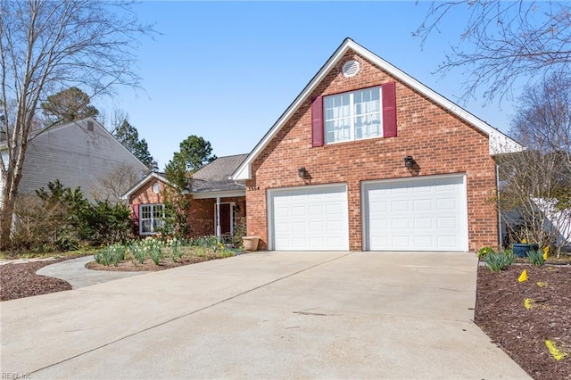 traditional-style home with driveway and brick siding