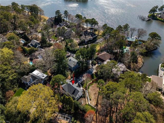 drone / aerial view with a water view and a residential view
