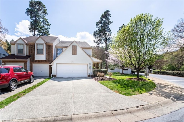 view of front of home featuring driveway, brick siding, and a garage