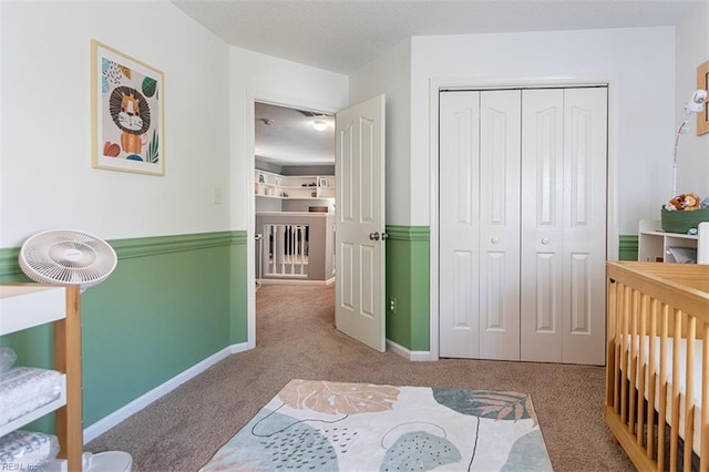 bedroom featuring baseboards, a closet, and carpet floors