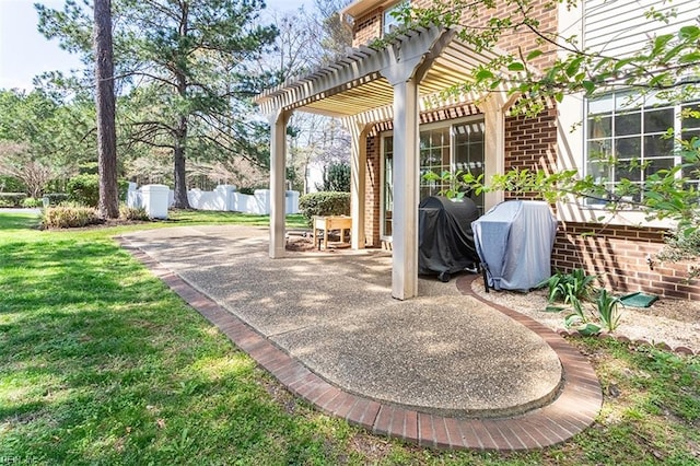 view of patio with grilling area, a pergola, and fence