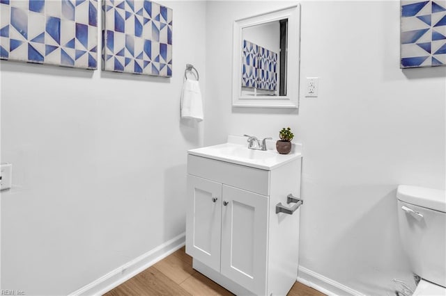1438 Lasalle Ave, Portsmouth, VA 23704 - half bath featuring baseboards, wood finished floors, toilet, and vanity