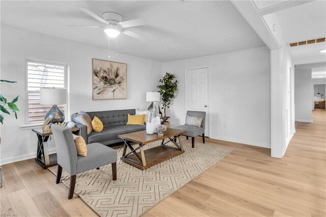1438 Lasalle Ave, Portsmouth, VA 23704 - living room featuring light wood finished floors, baseboards, visible vents, and ceiling fan
