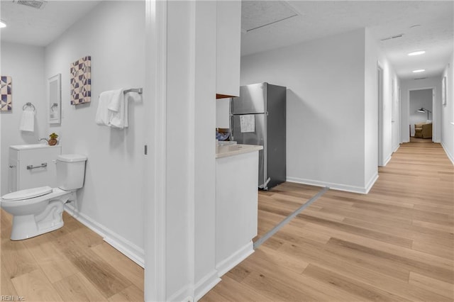 1438 Lasalle Ave, Portsmouth, VA 23704 - corridor with baseboards, visible vents, and light wood finished floors