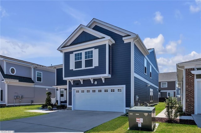 view of front of house featuring board and batten siding, a garage, driveway, and a front lawn