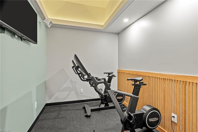 exercise area featuring wainscoting