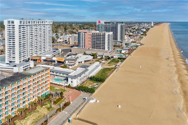 birds eye view of property with a city view, a beach view, and a water view
