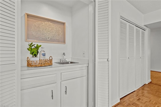 bar featuring wet bar and a sink
