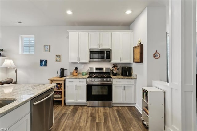 1012 Chartwell Dr, Newport News, VA 23608 - kitchen with appliances with stainless steel finishes, dark wood-style floors, visible vents, white cabinets, and recessed lighting