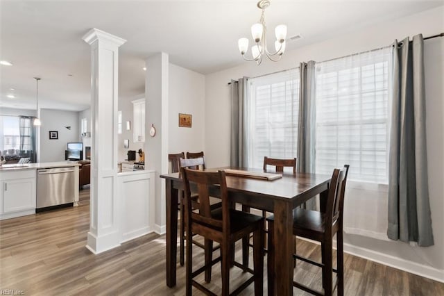 1012 Chartwell Dr, Newport News, VA 23608 - dining area with decorative columns, a notable chandelier, light wood-style flooring, and recessed lighting