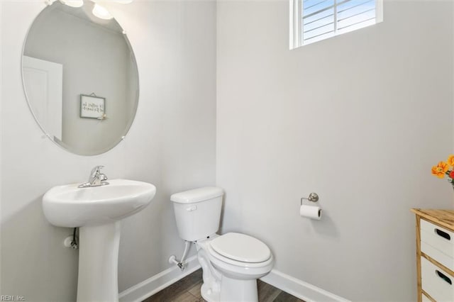1012 Chartwell Dr, Newport News, VA 23608 - half bath featuring baseboards, wood finished floors, toilet, and a sink