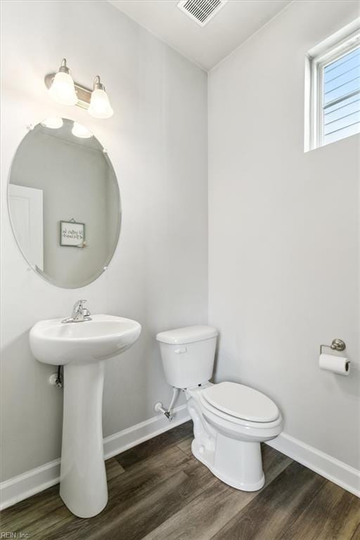 1012 Chartwell Dr, Newport News, VA 23608 - half bathroom featuring baseboards, visible vents, wood finished floors, and toilet